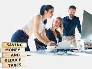 Best Tax Planning : A team of three professionals analyzing documents, with a SMART tax planning concept sign reading "Saving Money And Reduce Taxes.