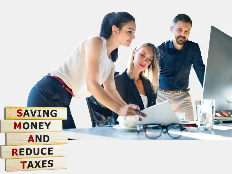 Best Tax Planning : A team of three professionals analyzing documents, with a SMART tax planning concept sign reading "Saving Money And Reduce Taxes.