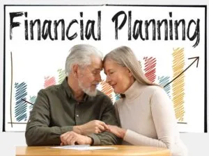 Financial Legacy : An elderly couple planning their financial future with a financial chart in the background, emphasizing long-term wealth management.