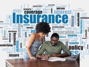 Best Insurance Options: A couple reviewing insurance documents with keywords related to insurance in the background.