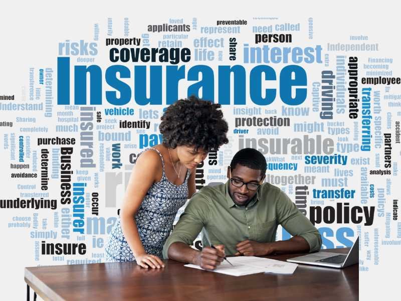 Best Insurance Options: A couple reviewing insurance documents with keywords related to insurance in the background.